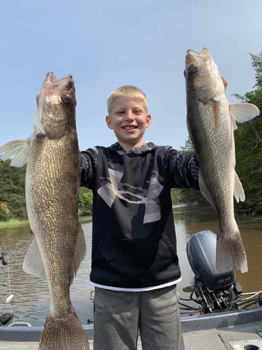 youth fisherman with catch