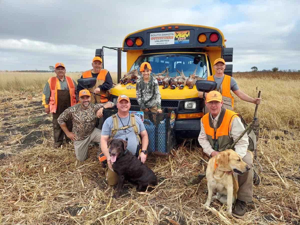 youth hunters in field