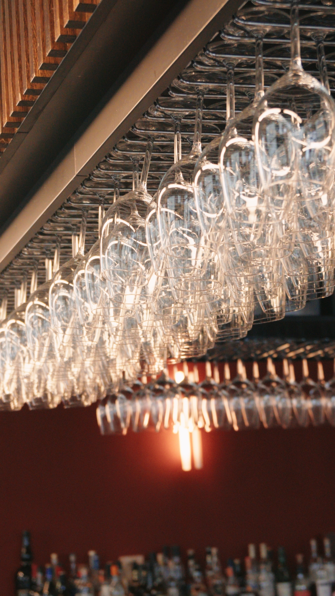 Wine glasses hanging above the bar