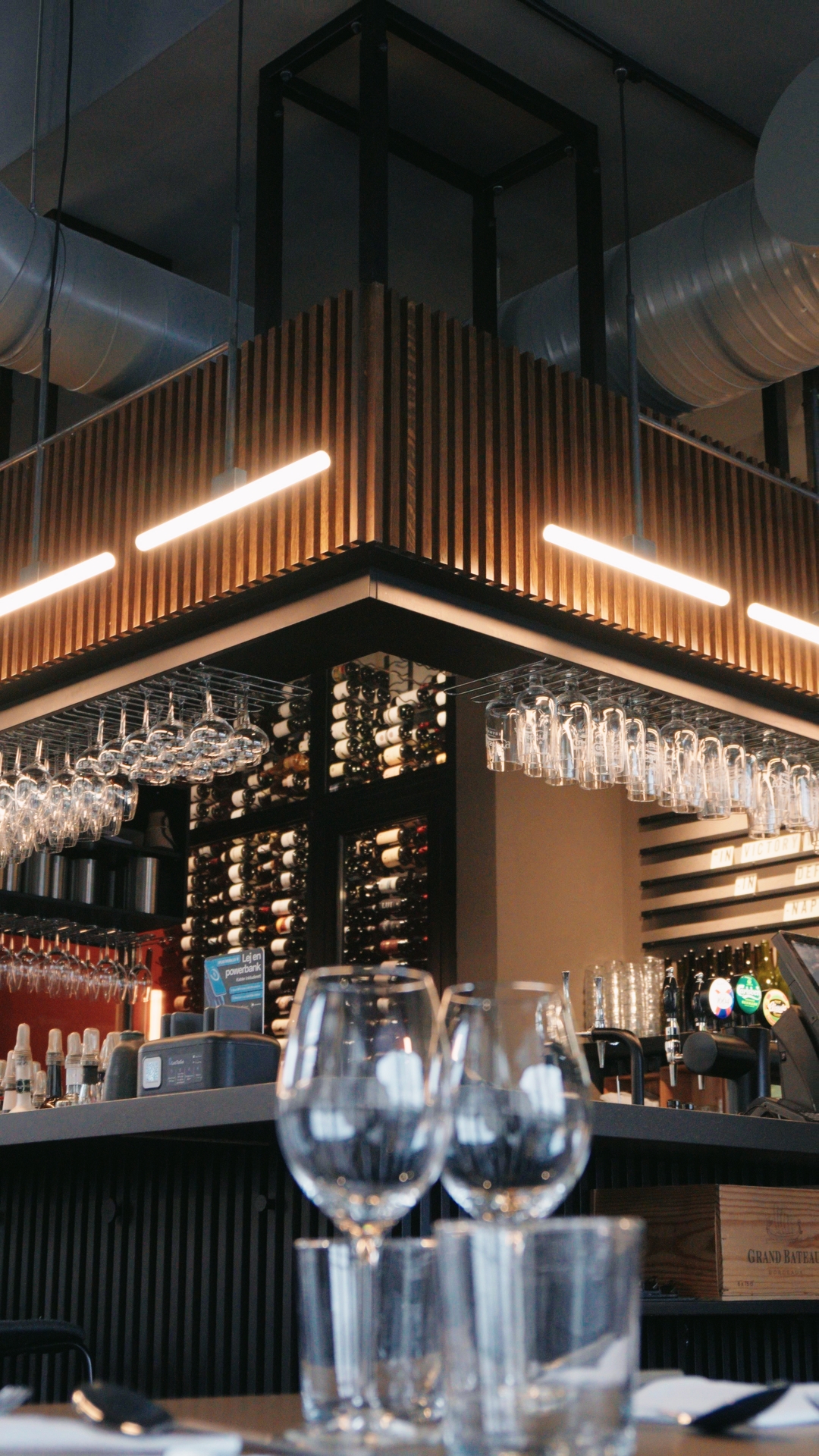 Restaurant bar with wine glasses and warm lighting
