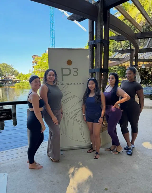 A Pilates Class Just Showed Up on a Dock in Cape Coral, Mimosa in Hand