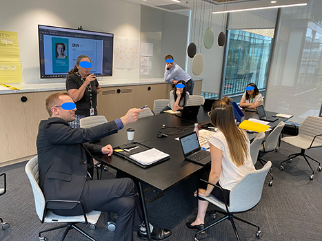 A photo of people discussing in an office.
