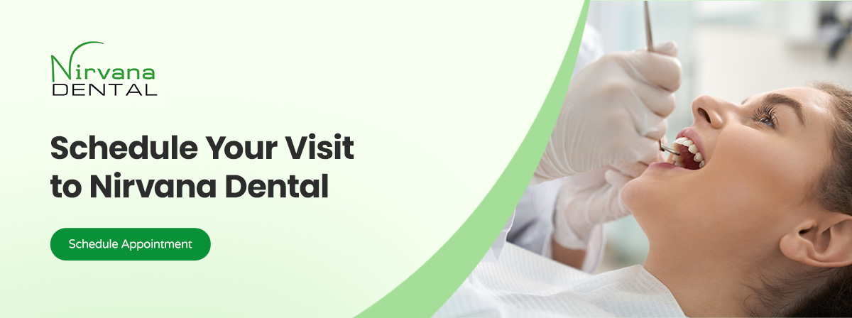 A dental patient is laying on her back while the dentist examines her teeth