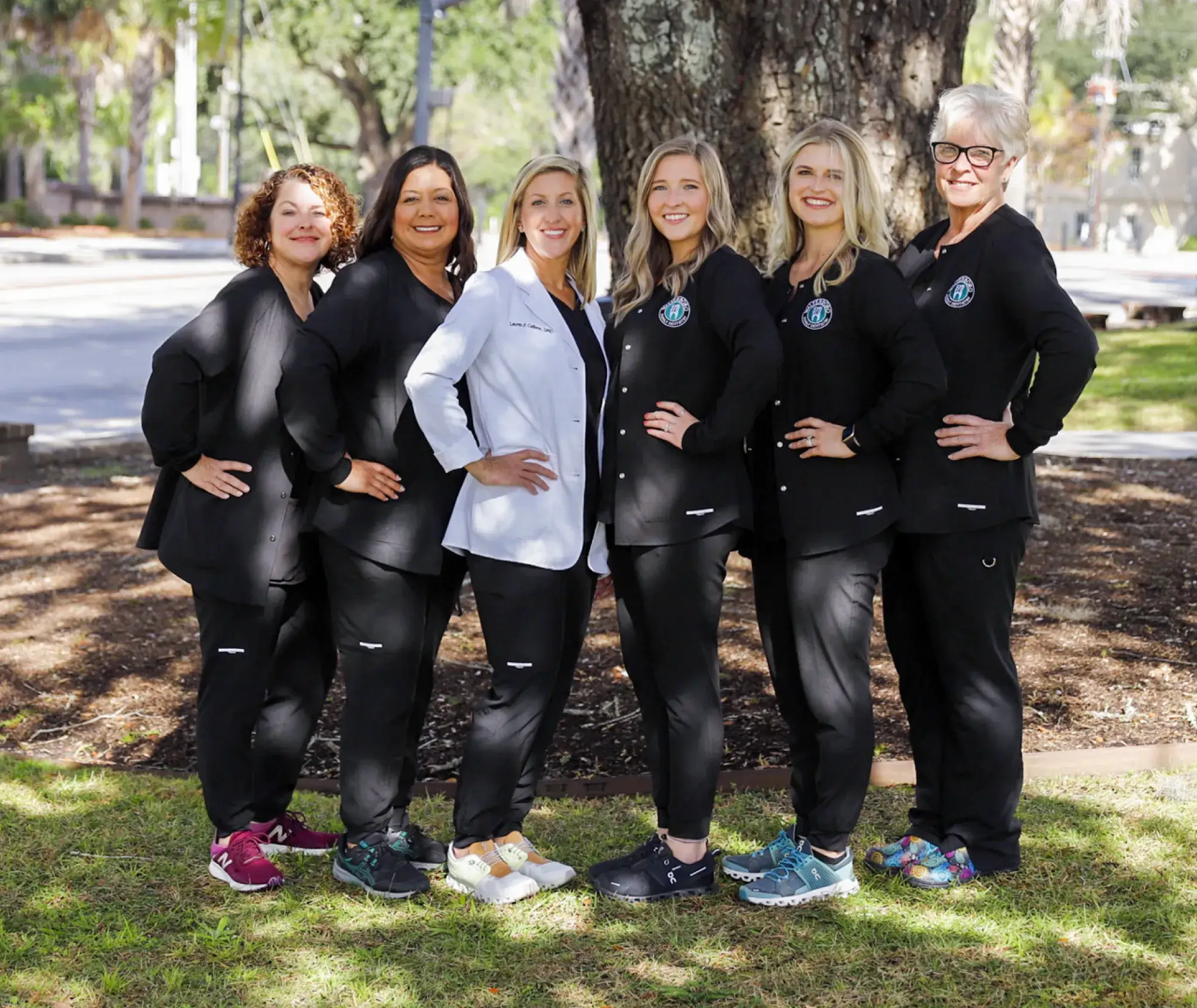a group of women standing next to each other
