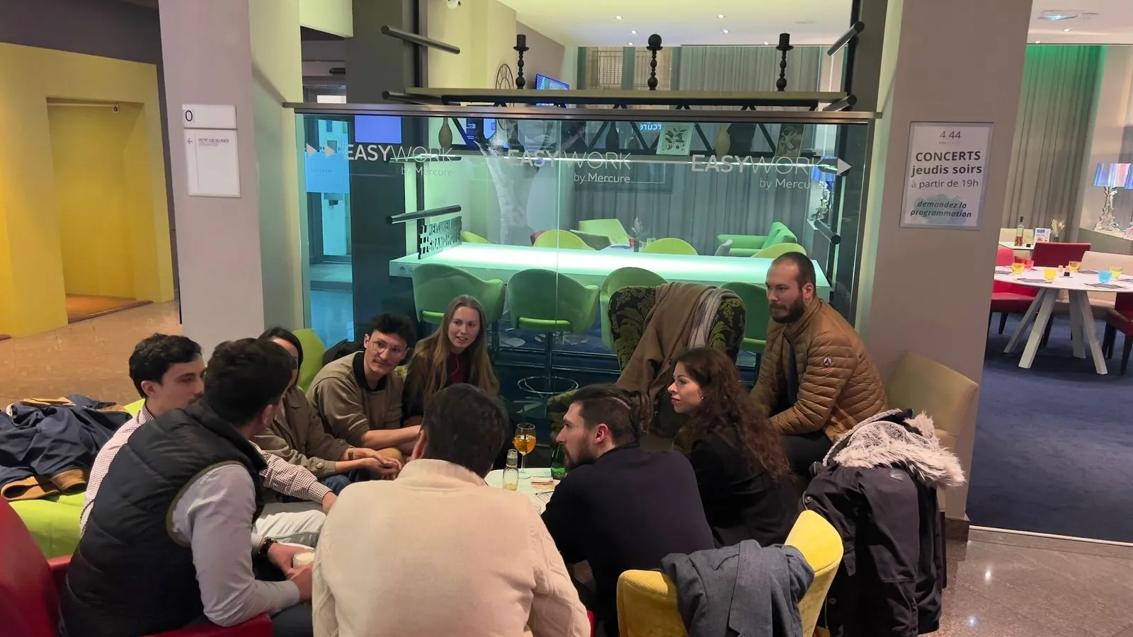 Members sitting in a circle during an evening in Nantes