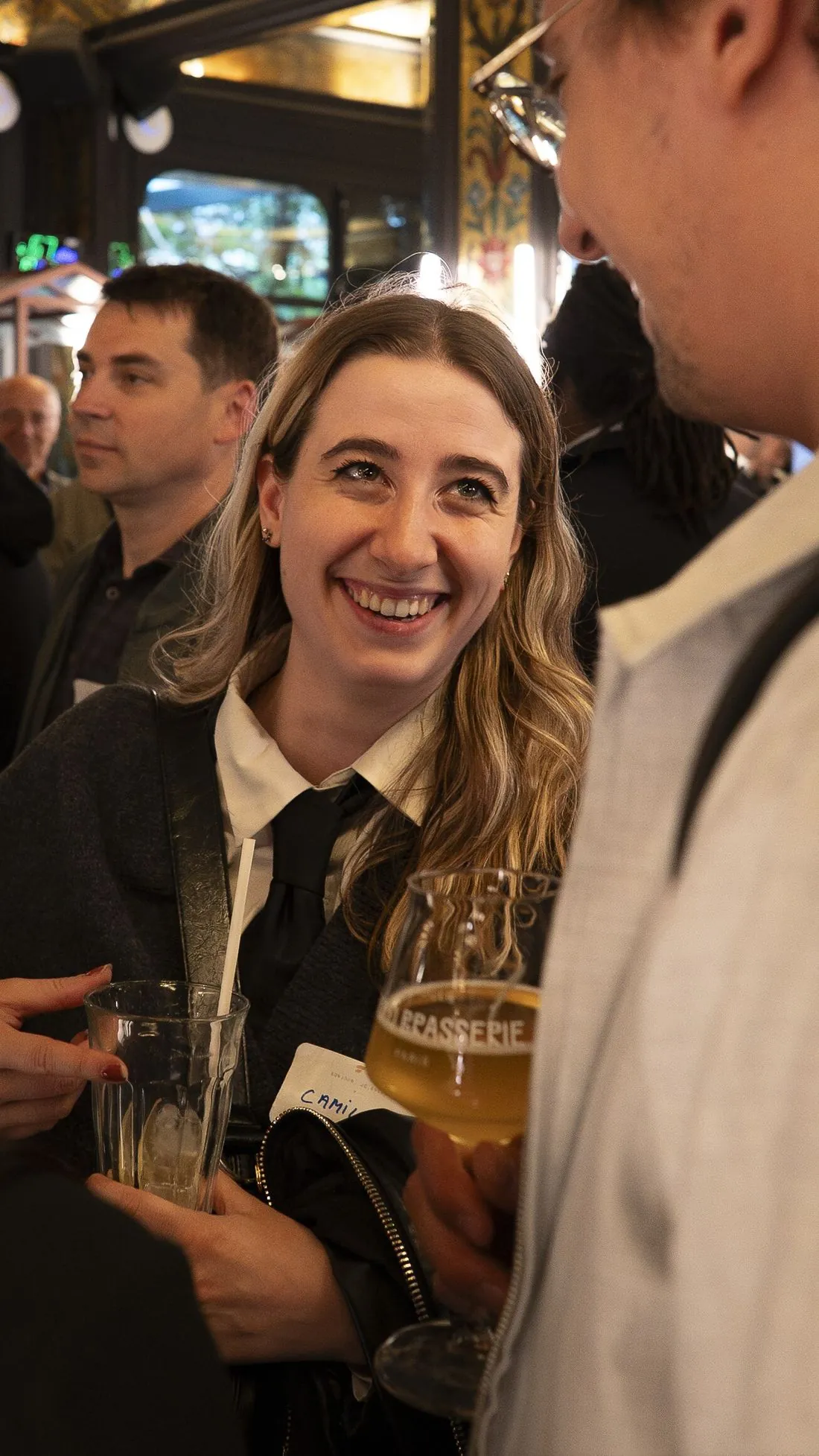 A member smiles during an evening in Paris