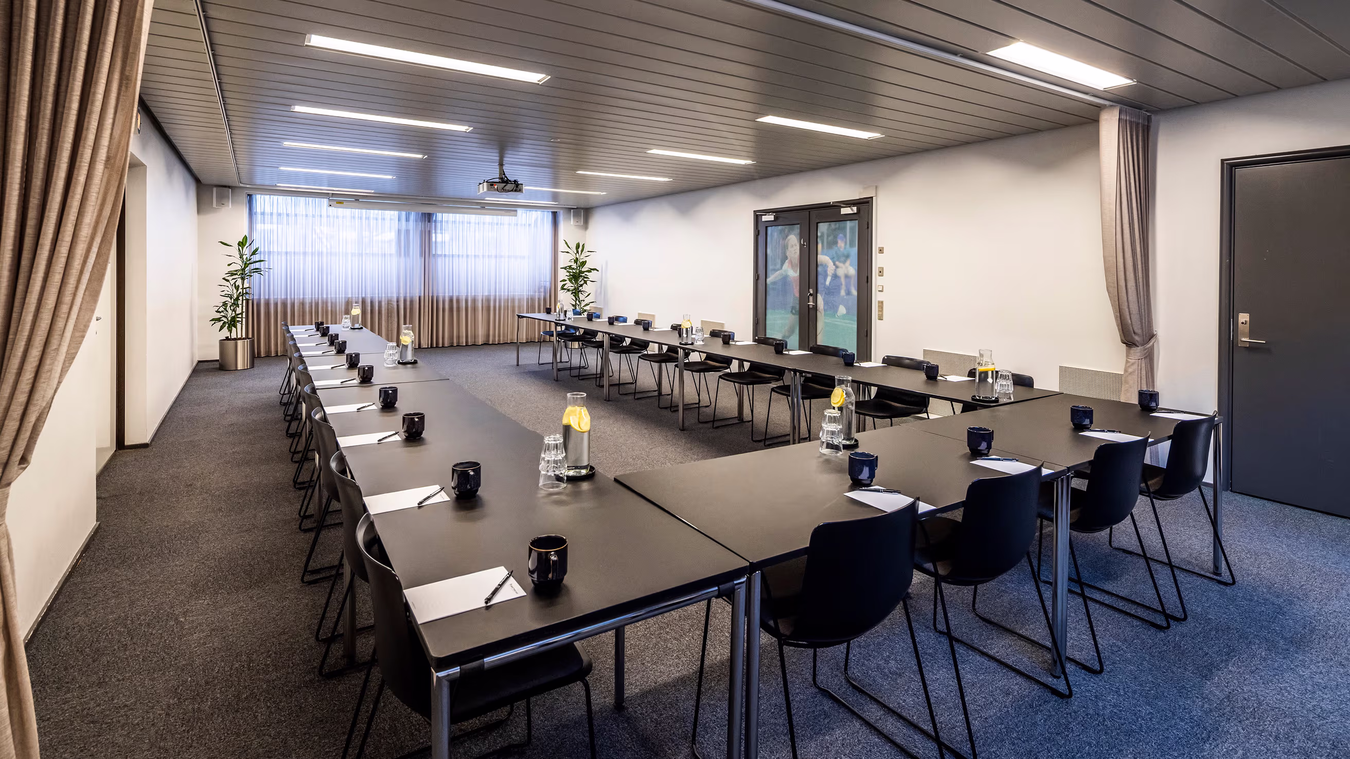 a room with tables and chairs in