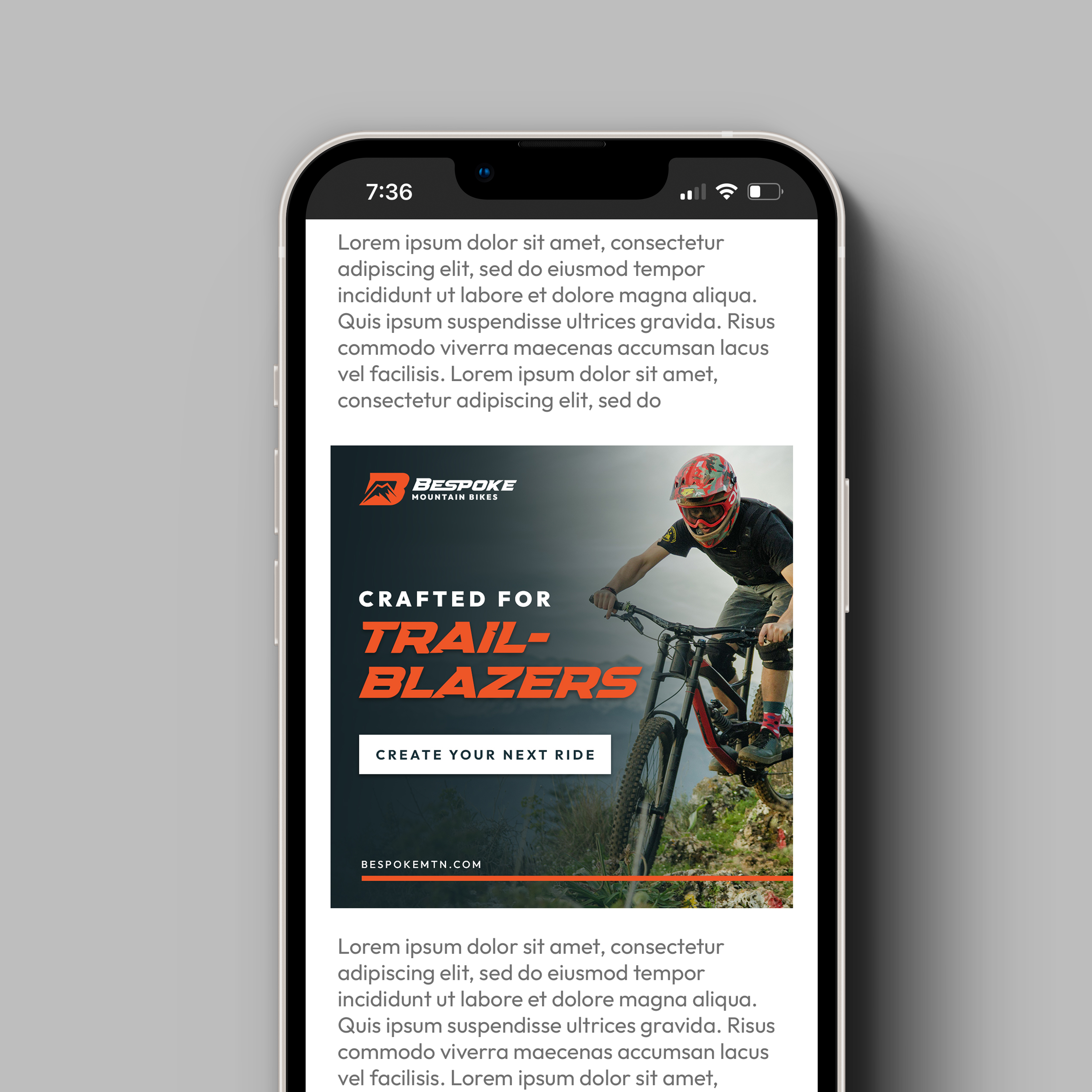 A phone showing a digital ad on a website for Bespoke Mountain Bikes that reads, "Crafted for Trailblazers. Create Your Next Ride." There is a photo on the right that features a person riding a mountain bike.