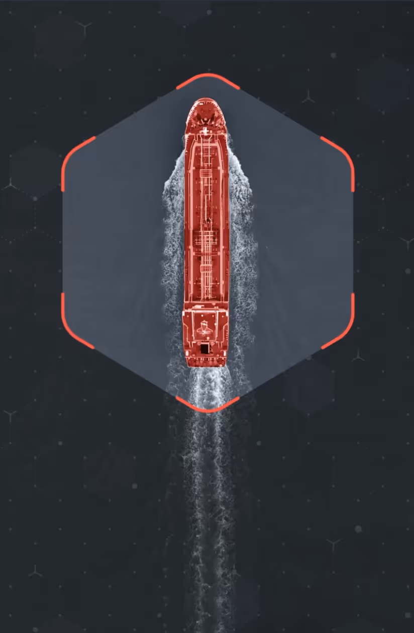 Top-down red-highlighted cargo vessel inside a hexagonal frame with wake.
