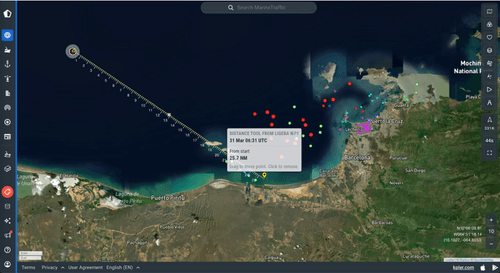 Satellite map showing a vessel’s distance measurement path from Ligera WP1 in the sea near Puerto Piritu and Barcelona, with various colored markers indicating ship positions.