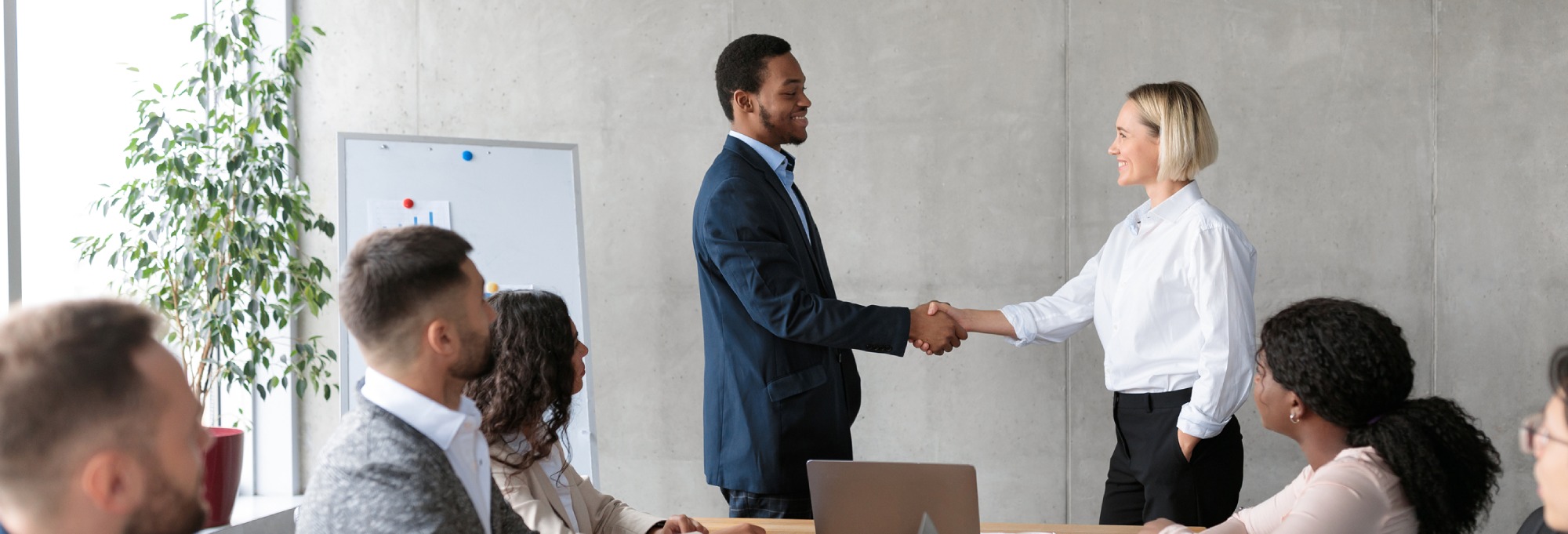 businessman-and-businesswoman-shaking-hands