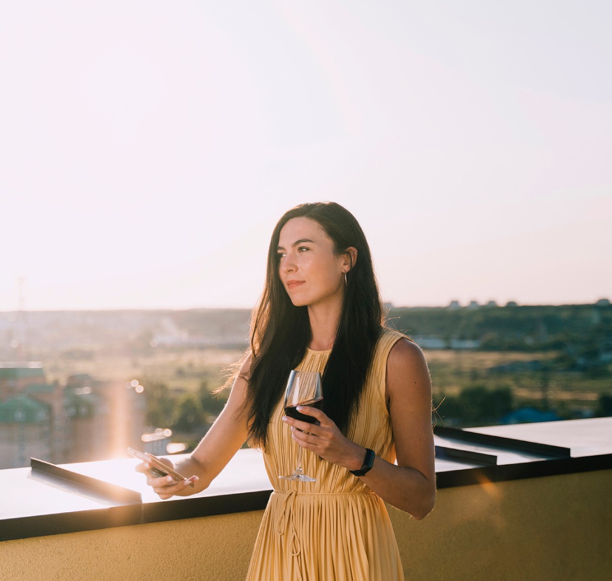 beautiful-woman-drinking-wine-rooftop-sunlight