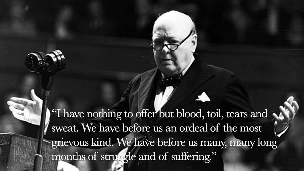 A historical black-and-white image of a man speaking at a podium, gesturing with his hands. He has glasses and is wearing a suit. Text overlay includes a quote about sacrifice and struggle, highlighting the challenges ahead. A microphone is positioned in front of him.