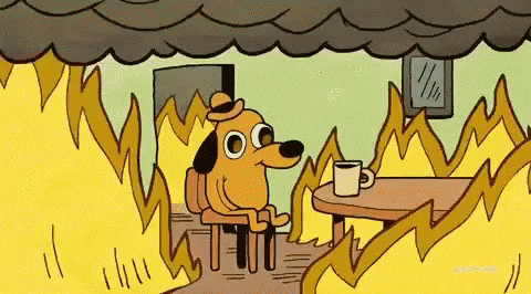 A cartoon dog sits at a table drinking coffee, seemingly calm despite the room being engulfed in flames.