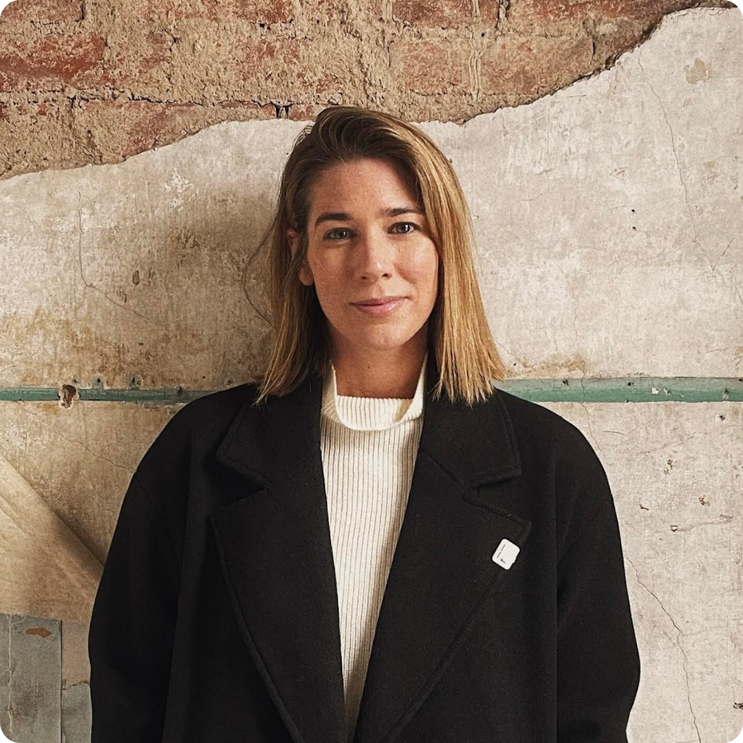 Ellen Howarth standing in front of a concrete wall