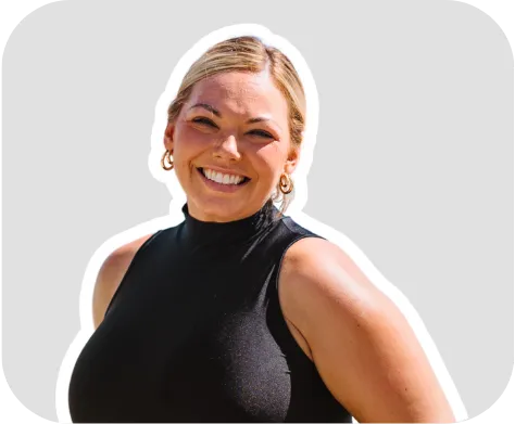 HeyOrca user Kylie smiling on a grey background.