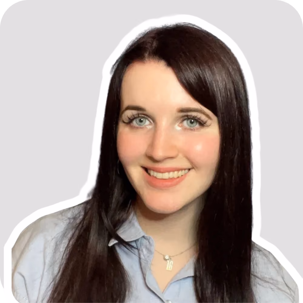 An image of a woman with long brown hair and glasses. She is smiling with a blue gradient background behind her,