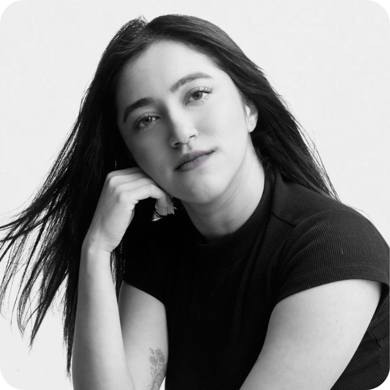 A black and white photo of a woman with long dark hair.