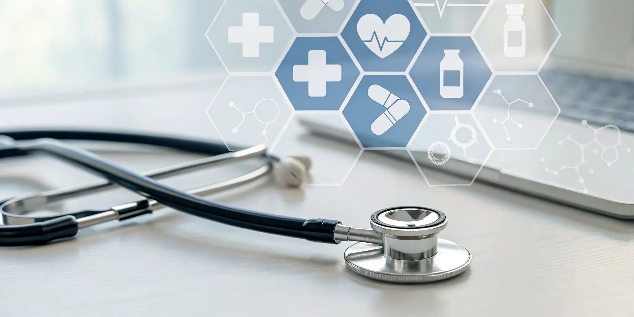 A Pairtu advocate's desk with a stethoscope and laptop, ready to provide expert Medicare support.