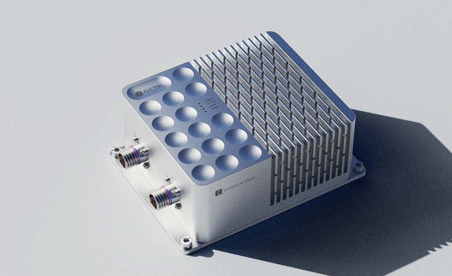 Compact, rectangular electronic device with cooling fins on one side and two circular connectors on the other.