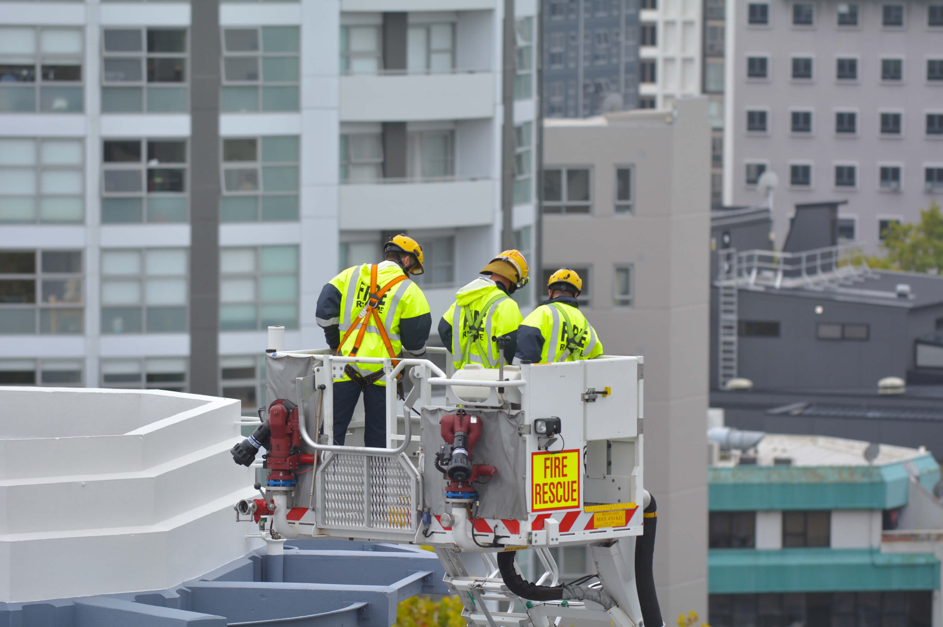 Fire rescue workers looking at buildings