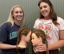 an image showing two parents who did dutch braids