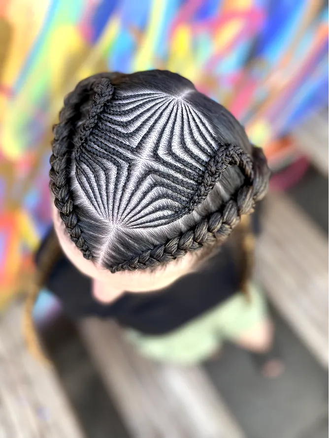 Student hands mid-braid