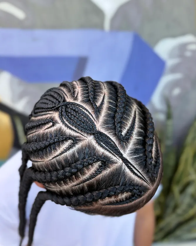 Student hands mid-braid