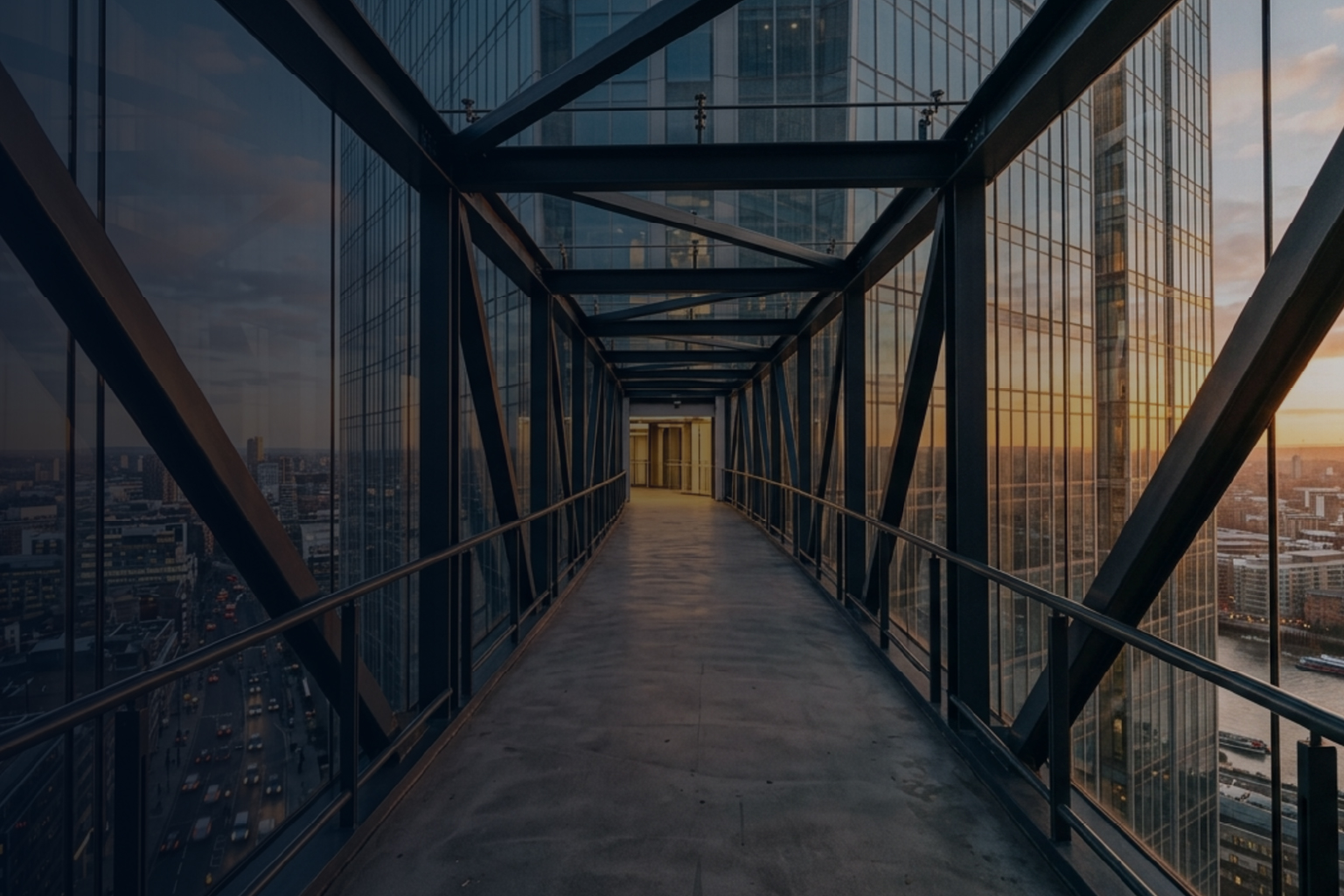 Interior view of glass skyscraper hallway at sunset 