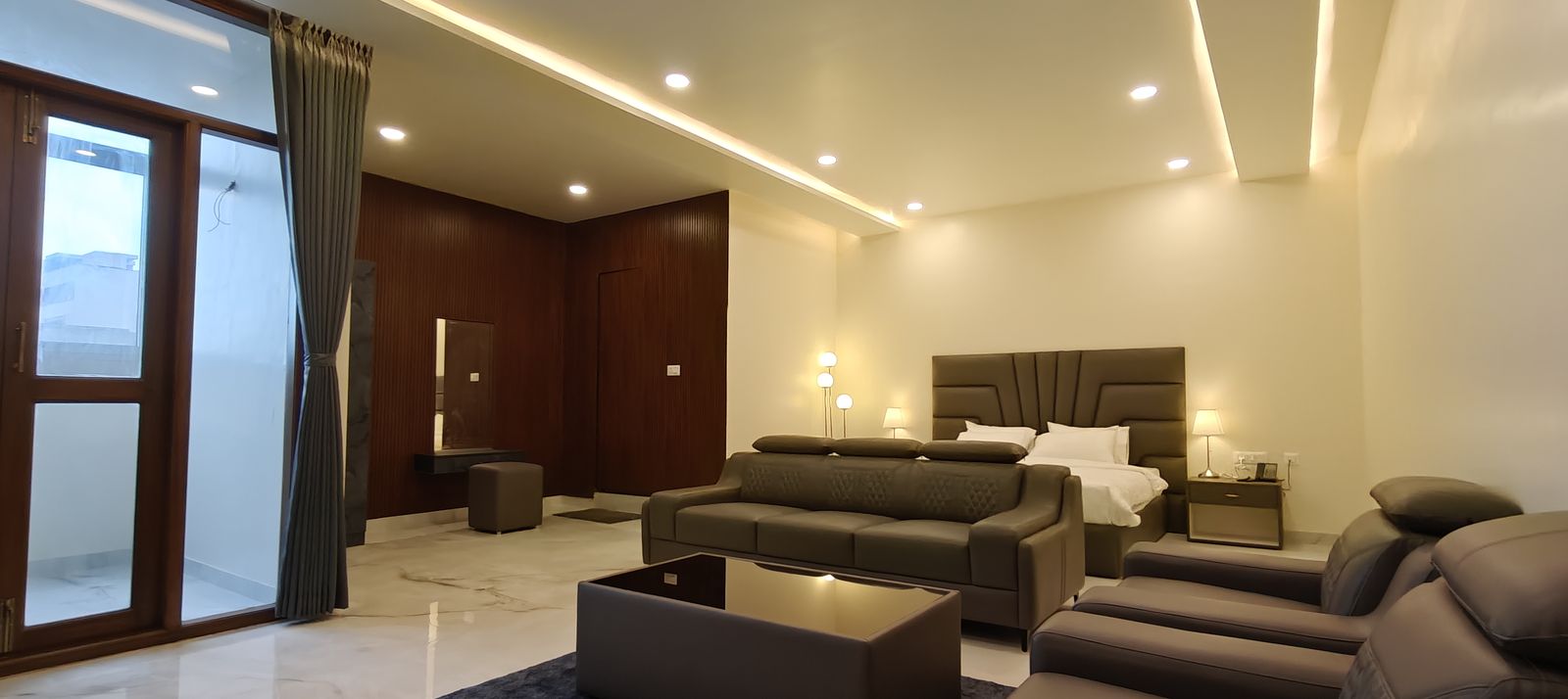 Premium family room with bed and sofa seating, hotel near Manyata Tech Park