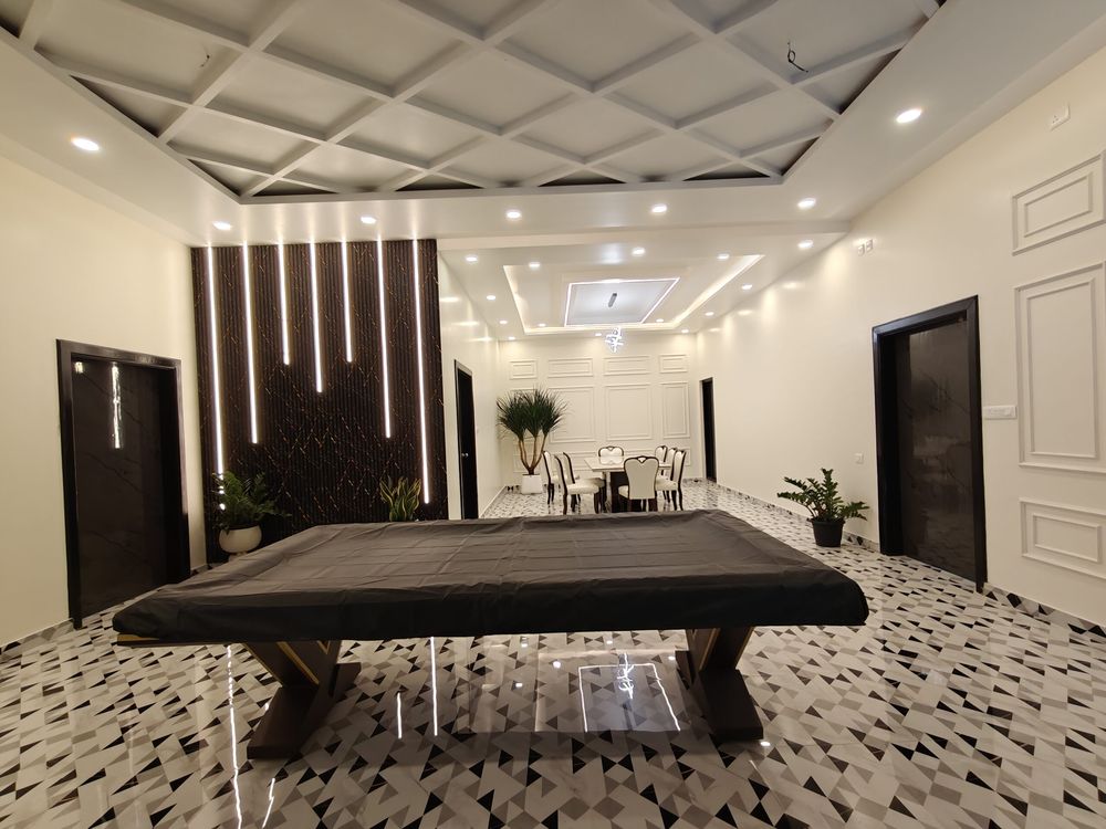 Penthouse living area with a pool table and lounge seating for parties