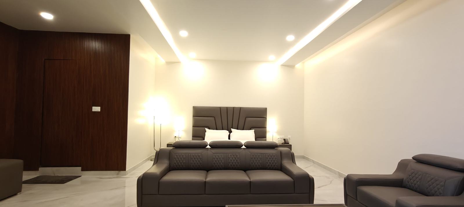 Hotel room with sofa seating to welcome relatives, rooms for wedding guests near Hebbal
