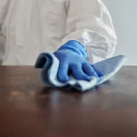 man cleaning table
