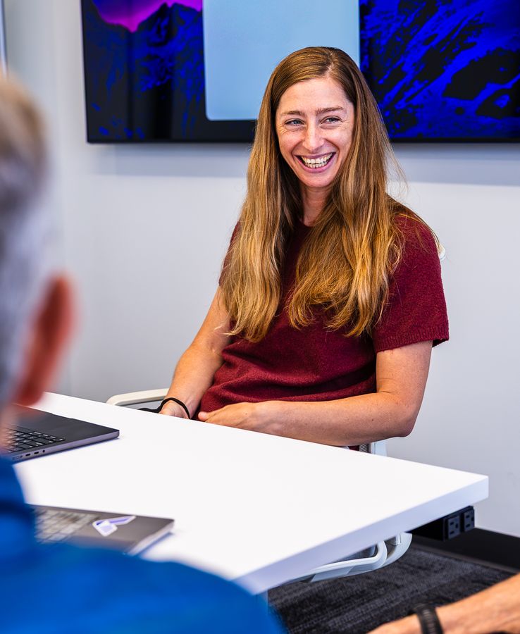 BigHat team member smiling during a meeting