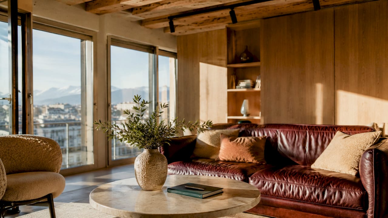 Raw plaster wall with natural light and furniture