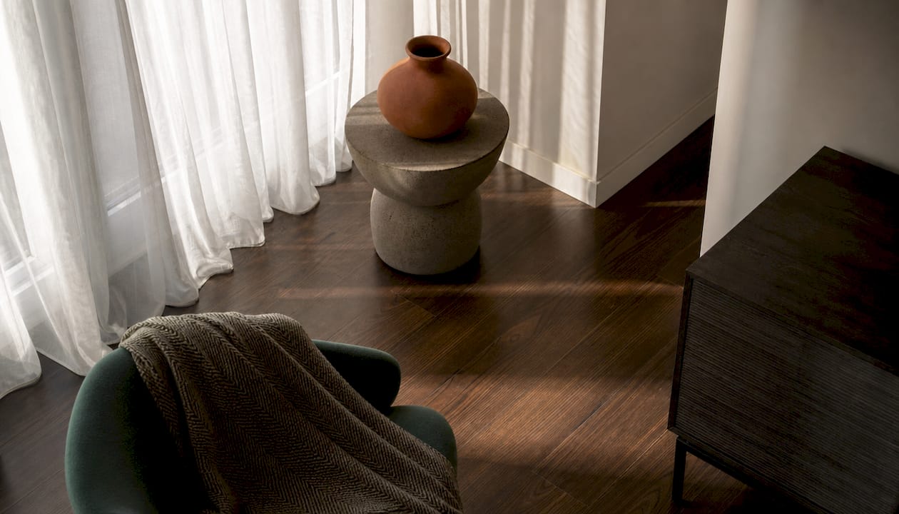 Oak flooring and stone table detail in Basel home