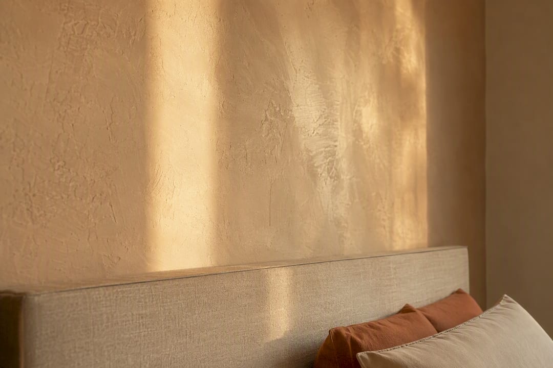 Hand-troweled plaster wall texture in bedroom