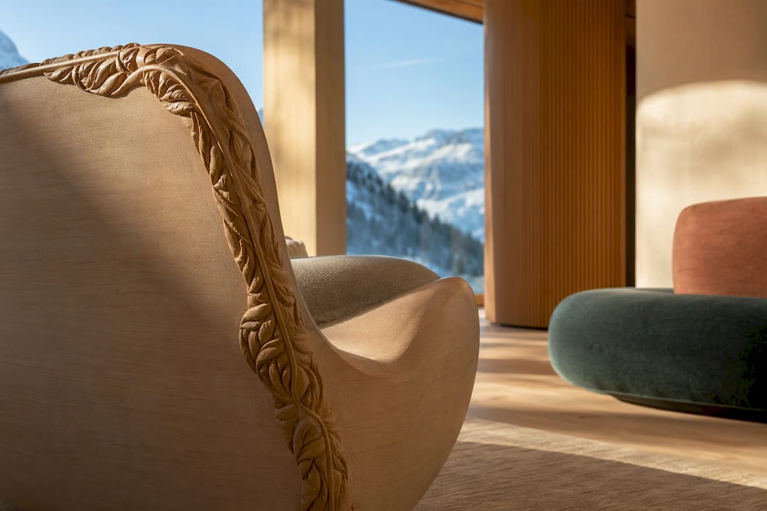 Curved wall and bespoke furniture in alpine interior