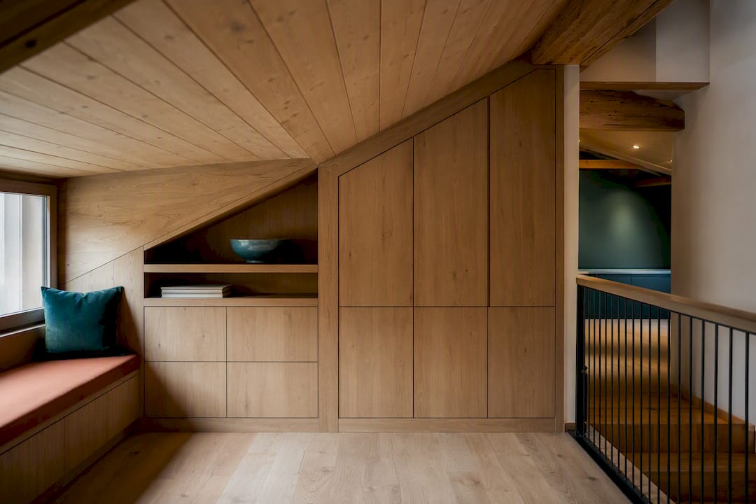 Bespoke joinery fitted beneath sloped chalet ceiling