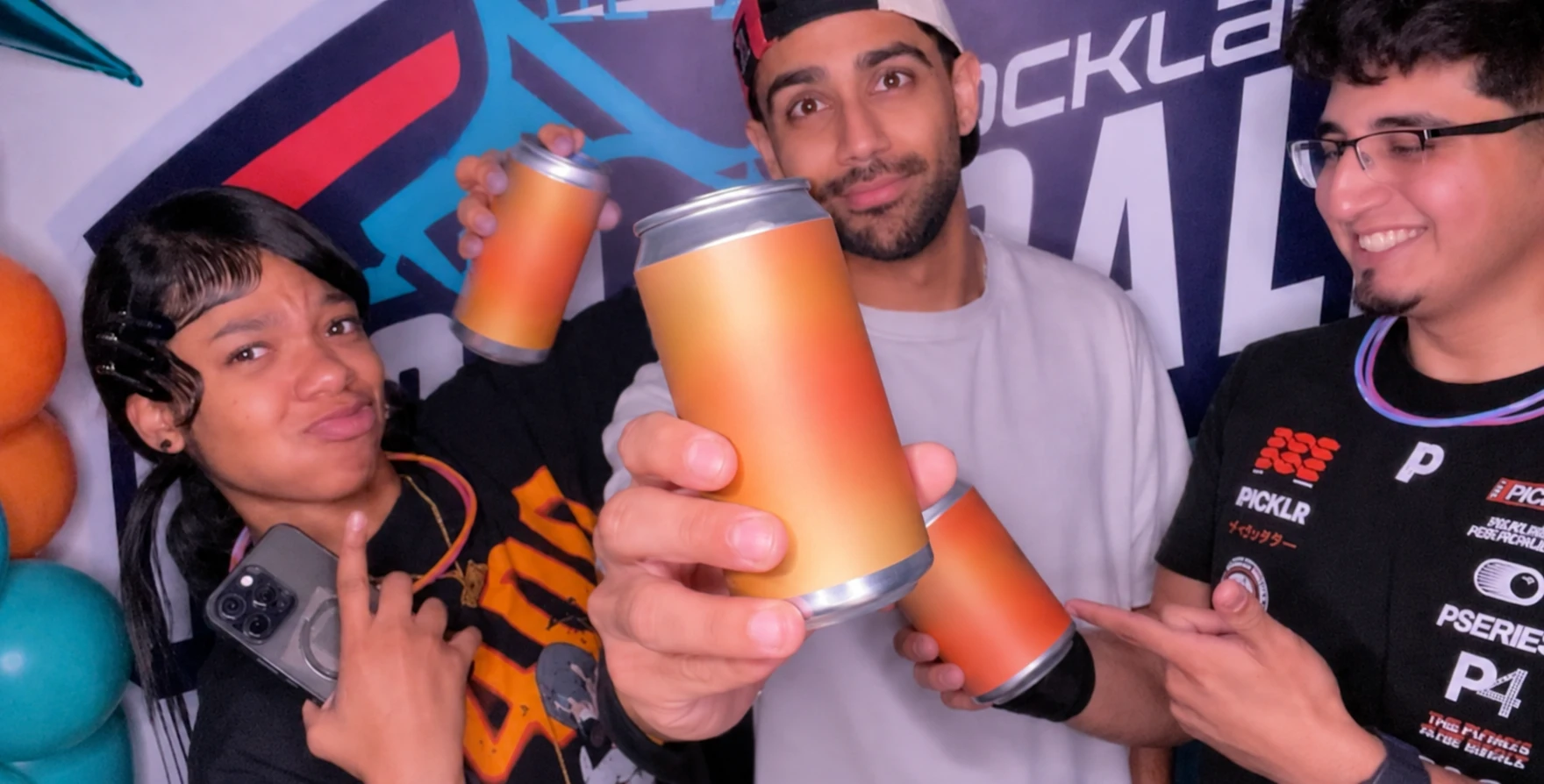 Consumers hold blinded cans of zero sugar tea at a live sampling event