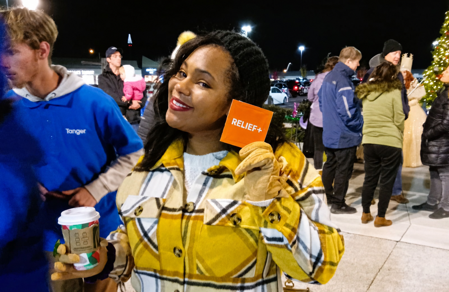 A shopper holds a sample of the chewable tablets at an evening outlet event
