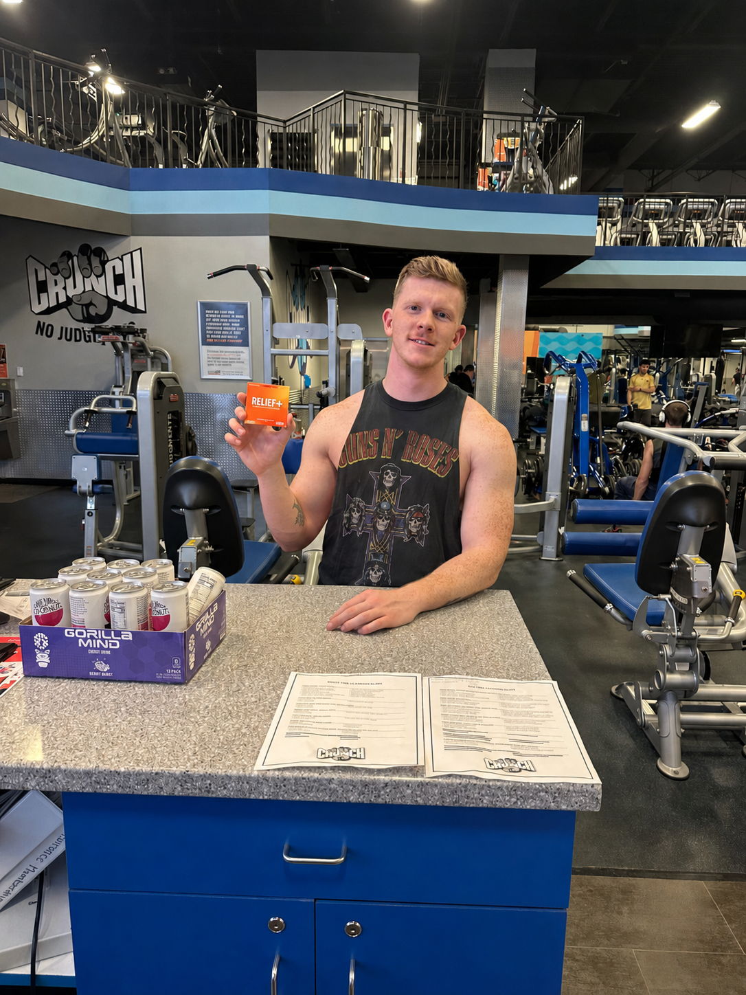 A fitness-studio member holds the new chewable format at the front desk