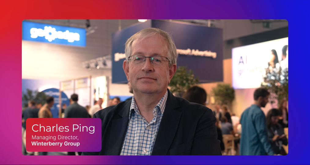 Charles Ping at conference against colorful background