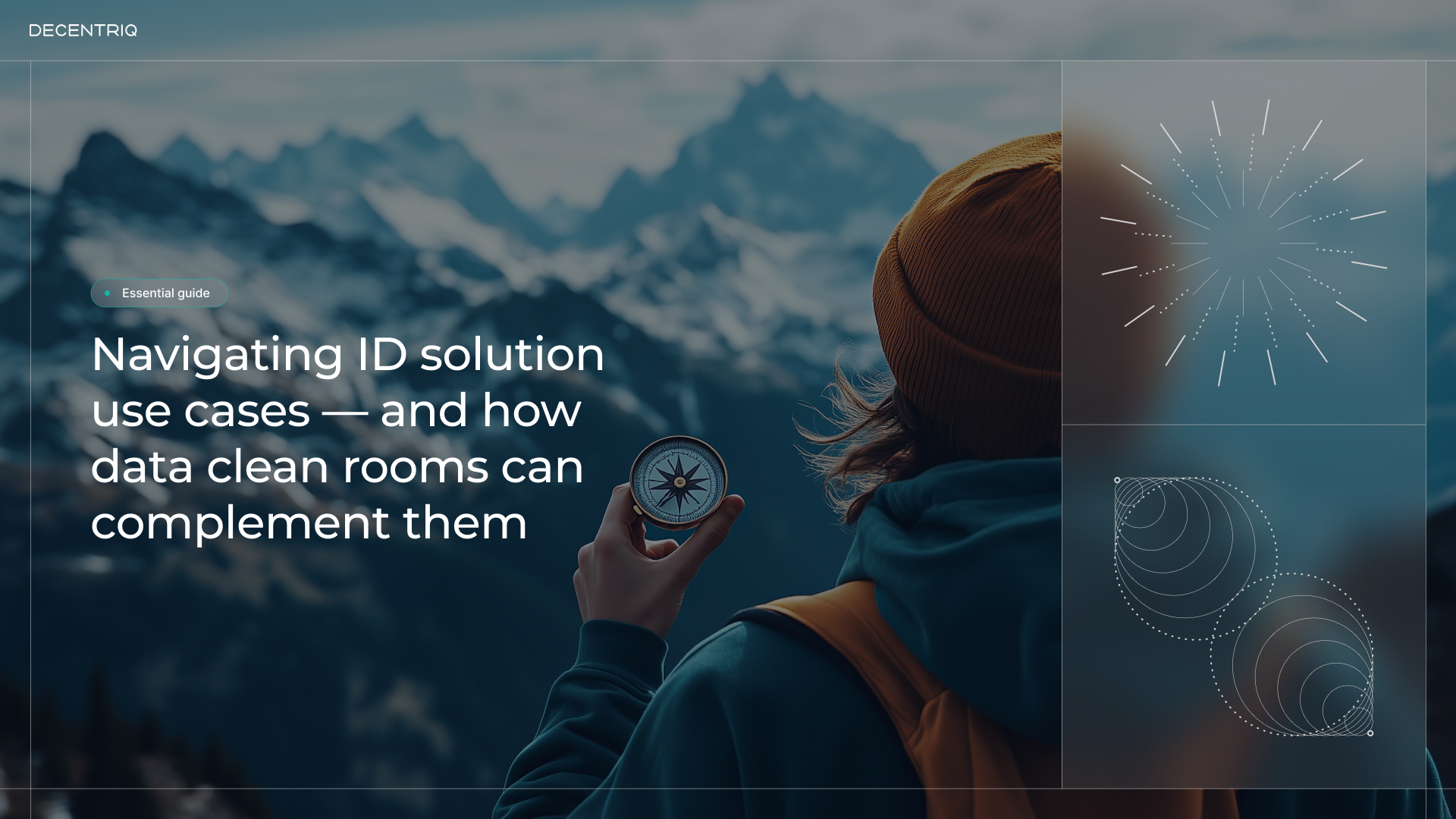 Person holding compass standing in front of mountain