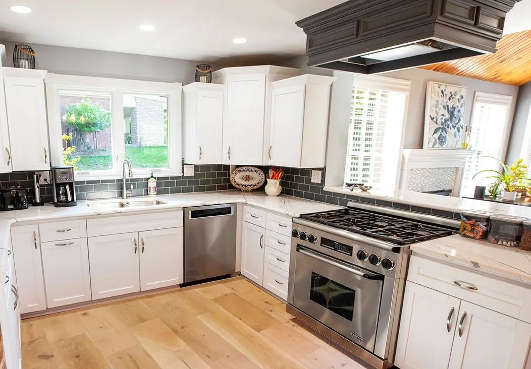 a kitchen with white cabinets