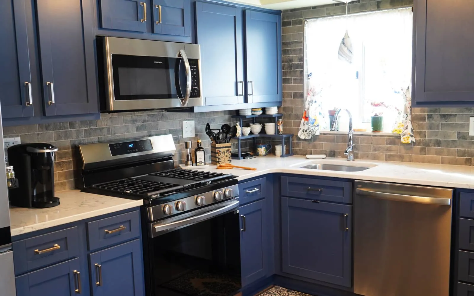 a kitchen with blue cabinets