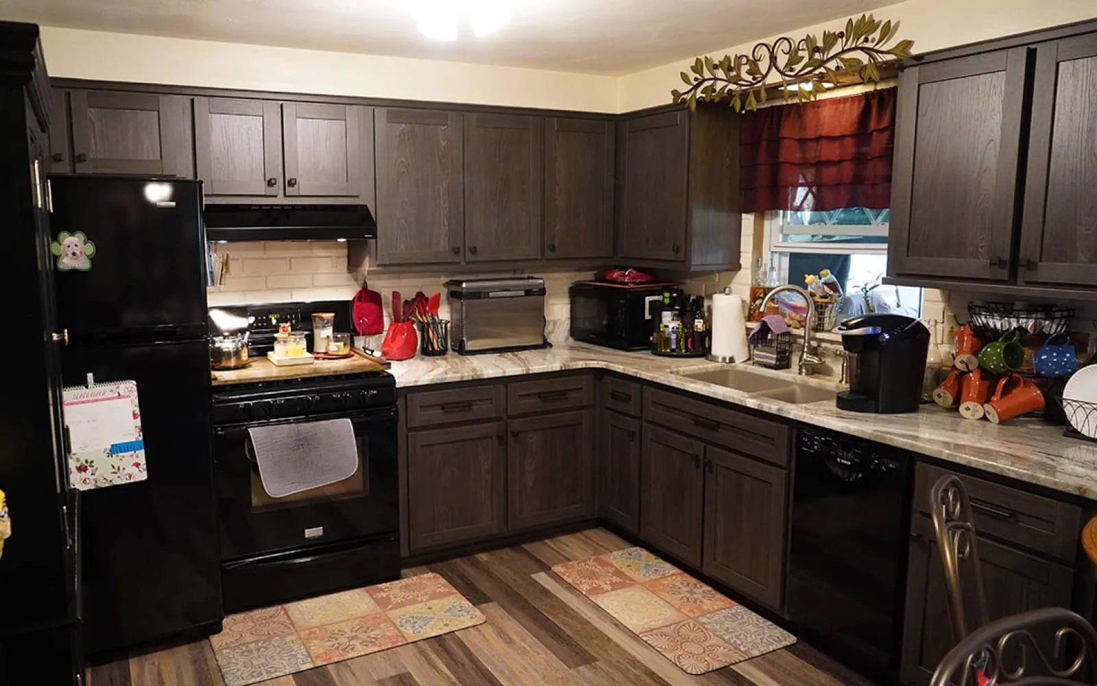 a kitchen with black appliances