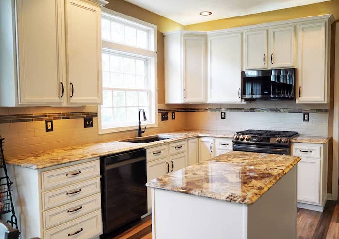 a kitchen with white cabinets