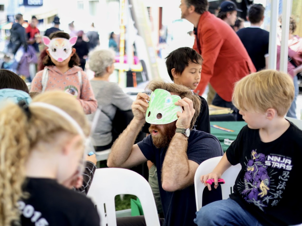 A woman picking up a brochure