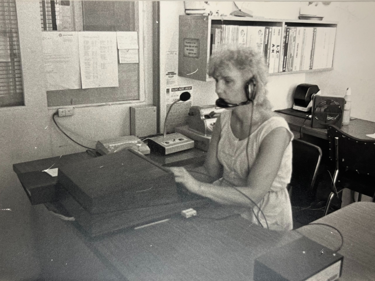 A woman picking up a brochure